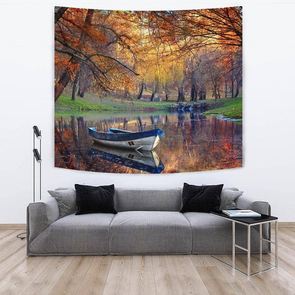 Boat on the lake in the autumnal forest